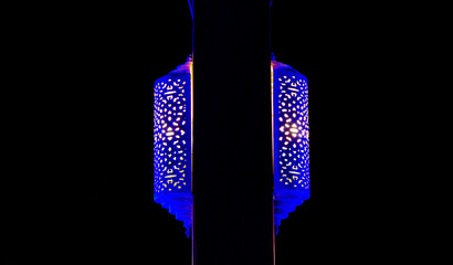 Arabian wall lamp at a wood pillar