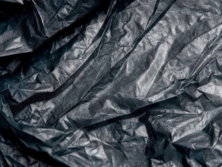 Close-Up Texture of a Crumpled Black Plastic Sheet