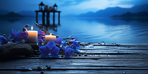 blue orchid and candle on a lake - obrazy, fototapety, plakaty