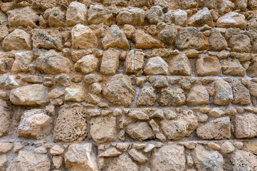 Texture of an ancient brick wall made of sandstone. Archaeological excavations