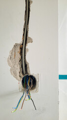 Plastic boxes in a brick wall to install sockets. Installation of sockets in a brick wall and...