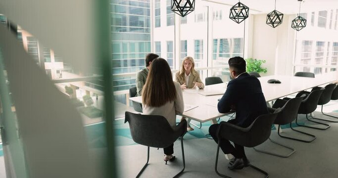 Negotiations between business parties in skyscraper office building. Board of directors share solutions, solve current issues gathered in boardroom, make deal, discussing partnership or cooperation