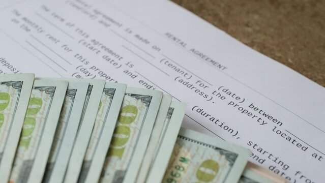 rental document and coins close-up