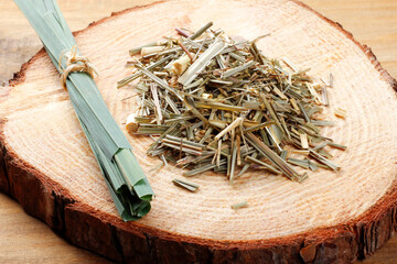 portion of dried organic lemongrass on rustic wooden table