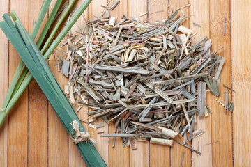 portion of dried organic lemongrass on rustic wooden table