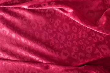 Smooth elegant red satin texture can use as abstract background. Luxurious background design
