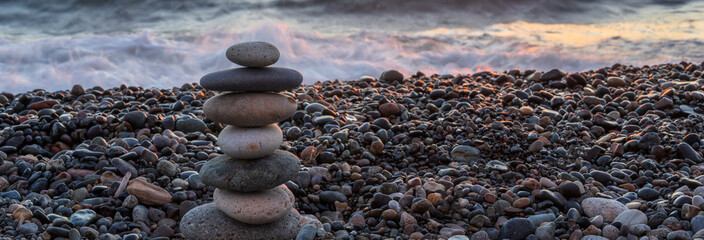 Stones stacked on top of each other on the seashore, harmony, balance