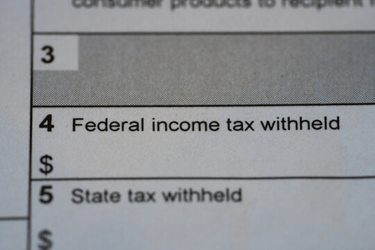 Federal income tax witheld in focus on IRS 1099 NEC form.