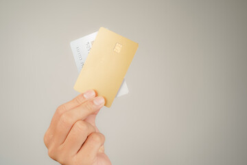 male hand holding many Bank credit Cards on isolated background