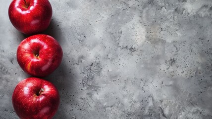 Red apples on textured gray surface - Powered by Adobe