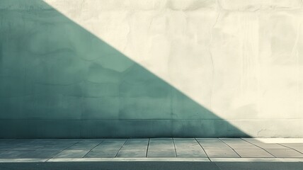 Sunlight casts diagonal shadow on textured wall above sidewalk - obrazy, fototapety, plakaty