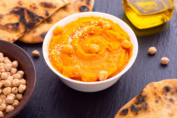 Declicious food from chickpea - pumpkin hummus . Israel and arabic kitchen
