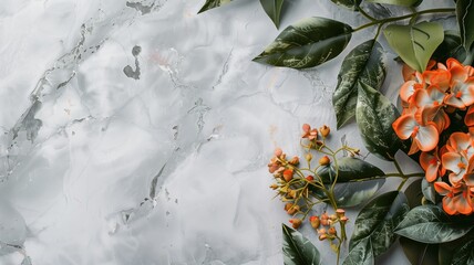 Orange flowers and green leaves on white marble background