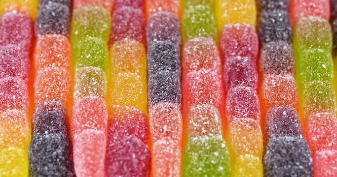 Bright jelly worms video background. Close up view on candy background. Top view on sweet food background with jelly candy.