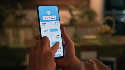 Woman buys plane tickets online. Choosing seats in a plane using booking app for mobile phone. - Powered by Adobe