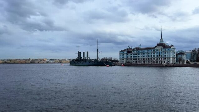 St. PETERSBURG, RUSSIA - April 20, 2024: The Aurora Cruiser Museum on the Neva River on a 20th-century warship. View of the cruiser Aurora, a historical warship, now a war memorial museum. 4К