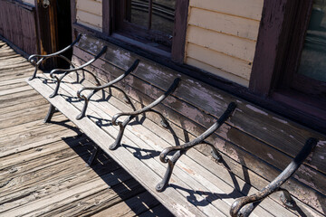 an old bench outside a train station