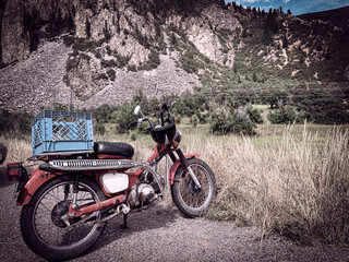 motorcycle along the side of a mountain road