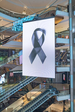 Large digital display showing a black ribbon inside Westfield at Bondi Junction in the Eastern Suburbs of Sydney, NSW during the morning of 21 April 2024 