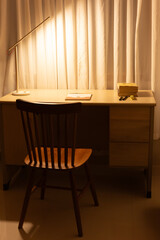 Dim lights, wooden tables and stools in studio, study