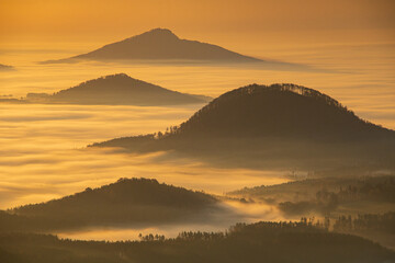 hilltops emerging from the mist at dawn