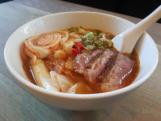Bowl of ramen noodles with meat and vegetables