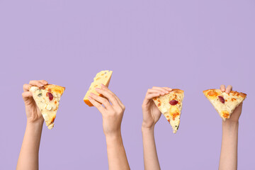 Female hands holding pizza slices and cheese on lilac background