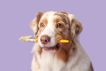 Cute dog with paint brush on lilac background