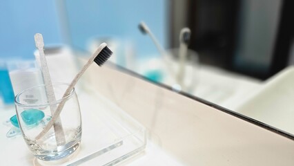 toothbrush in a hotel bathroom, hotel amenities, personal care products, clean, dental care,...