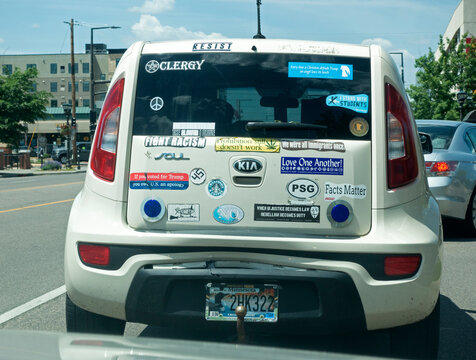 Clergy car for minister with political bumper sticker signs on the car. Minneapolis Minnesota MN USA