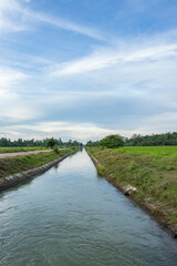 Fototapeta na wymiar Irrigation of rice fields in Indonesia
