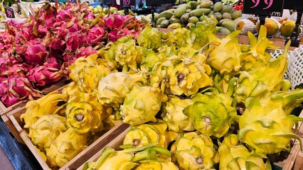 dragon fruits displayed in supermarkets, yellow dragon fruits, tropical, 