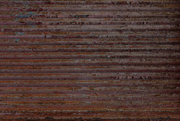 Rough, rusted, weathered corrugated iron background. Horizontal lines with weathered pattern.
