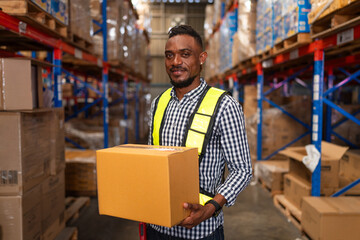 Male warehouse employee worker enjoy working and holding box  in warehouse, Logistic industry...