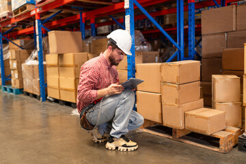 Portrait of Warehouse employee worker with digital tablet on warehouse, Logistic industry concept.