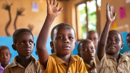 African children raising their hands in a classroom