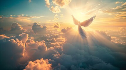 An angel flies in the sky above the clouds toward the sun. - obrazy, fototapety, plakaty
