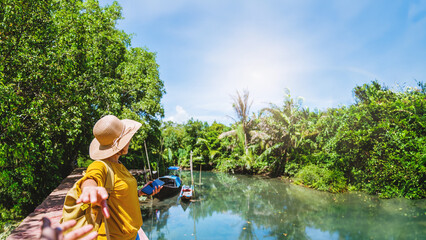 Asian couple holding hands, traveling nature. Travel relax. at tha pom-klong-song-nam. Krabi, in...