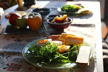Morning breakfast with eggs and salad in the sun.