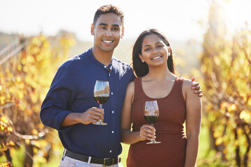 Couple, portrait and happy at vineyard with glass for wine tasting, hug and vacation in...