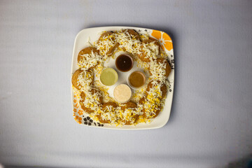 special Fuchka, dahi puri, pani puri, or gol gappa with sauce and chutney served in dish isolated...