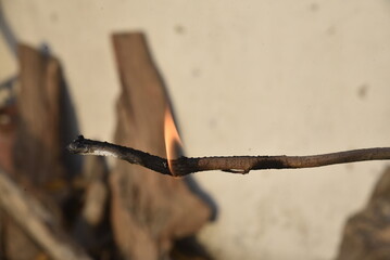 burning match on a fire - 790544379