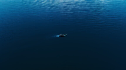 Fototapeta na wymiar A small boat in the middle of the sea