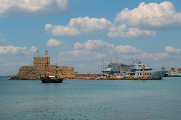 View of the fortress and entrance to the Mandraki port in Rhodes, Rhodes Island, Rhodes city, Greece