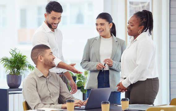 Business people, meeting and laughing with laptop at office for collaboration or team building in boardroom. Group of young or happy employees on technology in fun or friendly discussion at workplace
