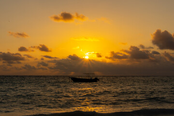 Small boat on the sea at sunrise in Punta Cana