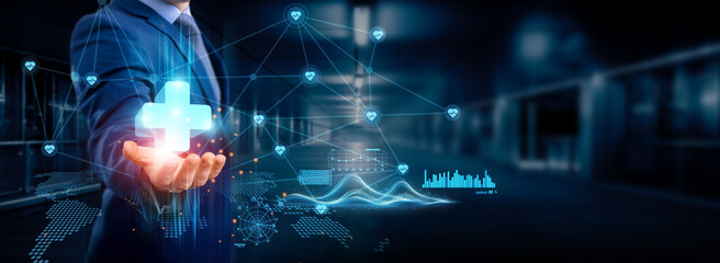 Businessman holding health IT icon global structure, networking and data integration for seamless connection, digital healthcare innovation, telemedicine solutions, and healthcare network.