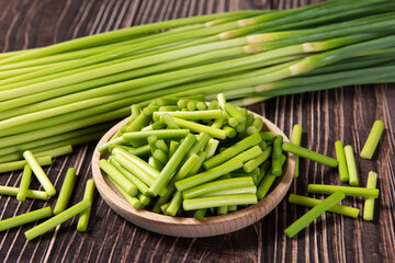 fresh garlic bolt on wooden table.