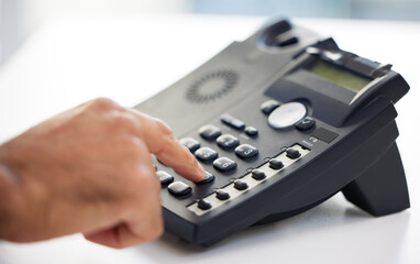 Person, hand and telephone or dial number for calling communication, networking or contact us. Fingers, desk and telemarketing call for virtual sales with technical support, connection or business