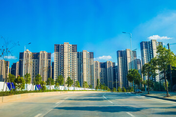 Fototapeta na wymiar Spacious urban road buildings and residential areas